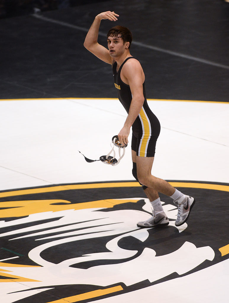 Dack Punke hypes up the crowd after winning his match